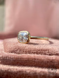 Close-up of the 2.50 CT cushion diamond showcasing its E color and VVS2 clarity