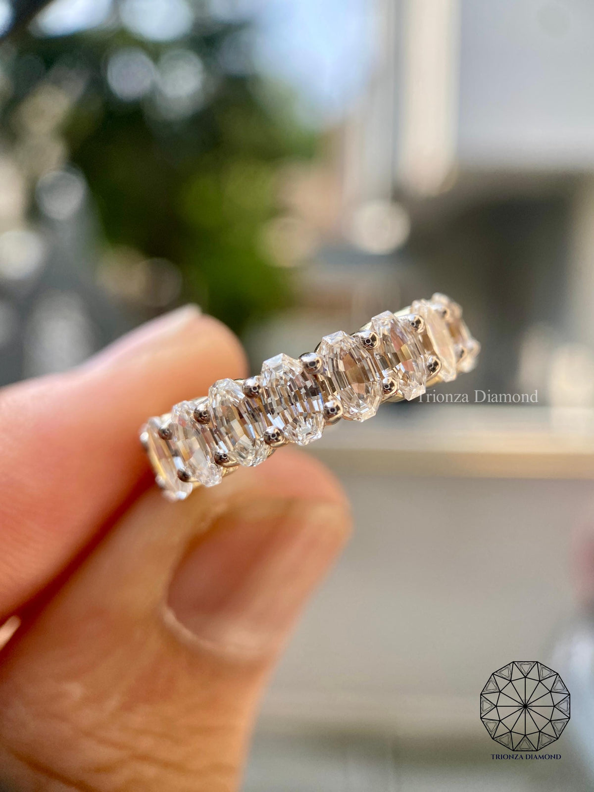 Oval eternity band ring presented in a jewelry box for gifting