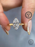 Marquise cut lab grown diamond ring displayed to highlight its 6 prong cathedral setting