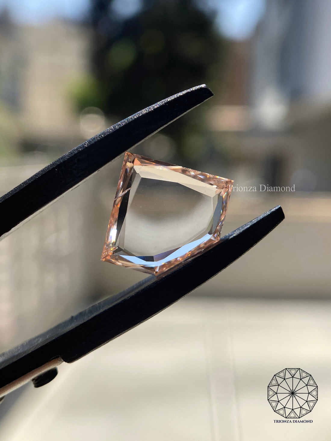 Trilliant rose cut lab grown diamond displayed to highlight its sharp faceted shape