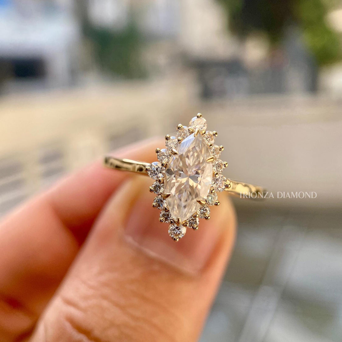 Marquise cut lab grown diamond ring featuring a starburst halo setting in 14k solid gold