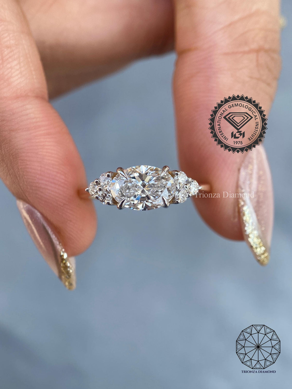 Oval east-west lab grown diamond engagement ring featuring a straight shank with accent shoulders