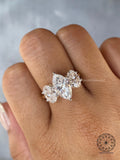 Side view of the three stone ring highlighting the prong settings engineered for strength and shine