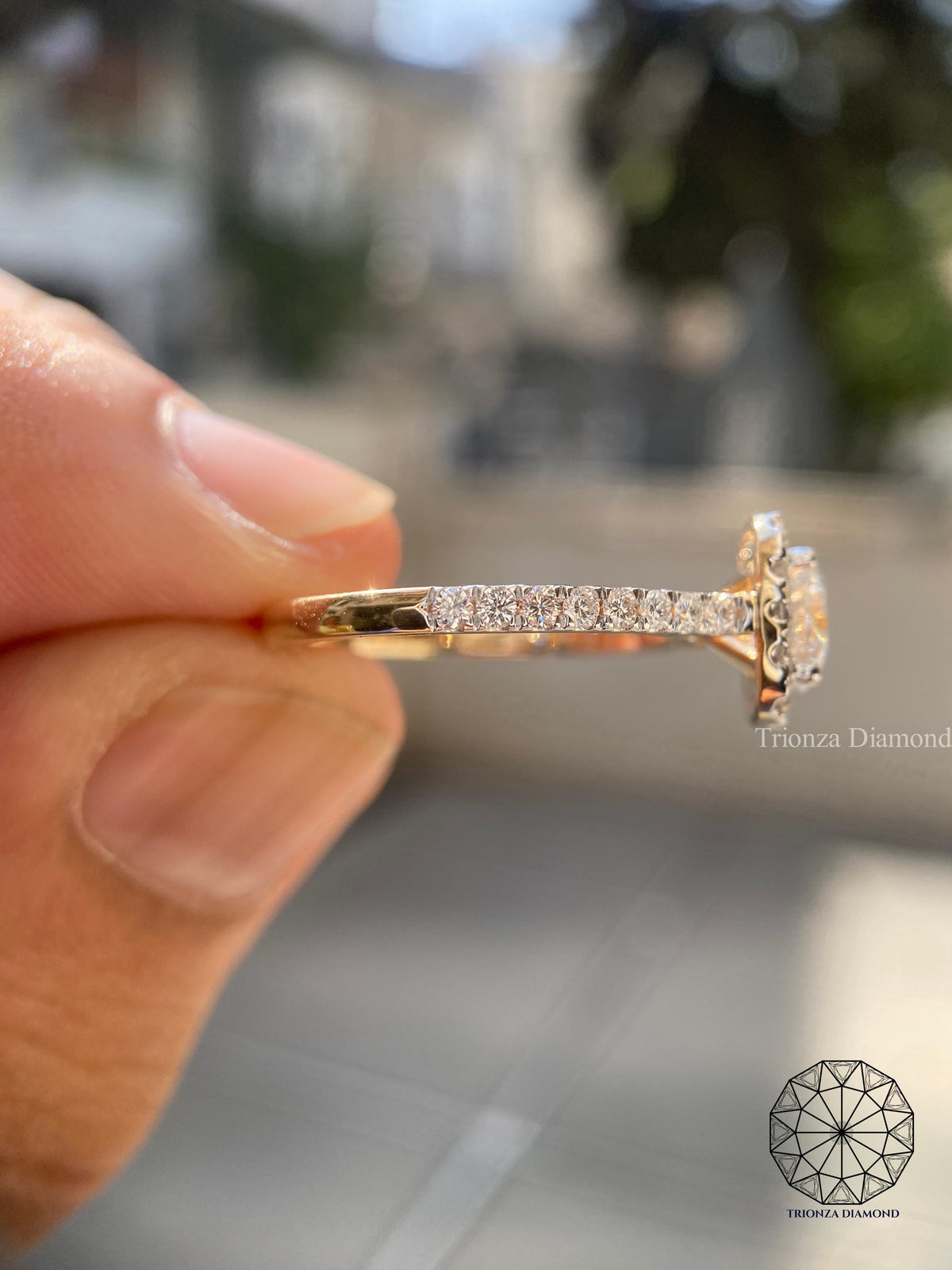 Woman wearing the round cut diamond halo engagement ring on her hand