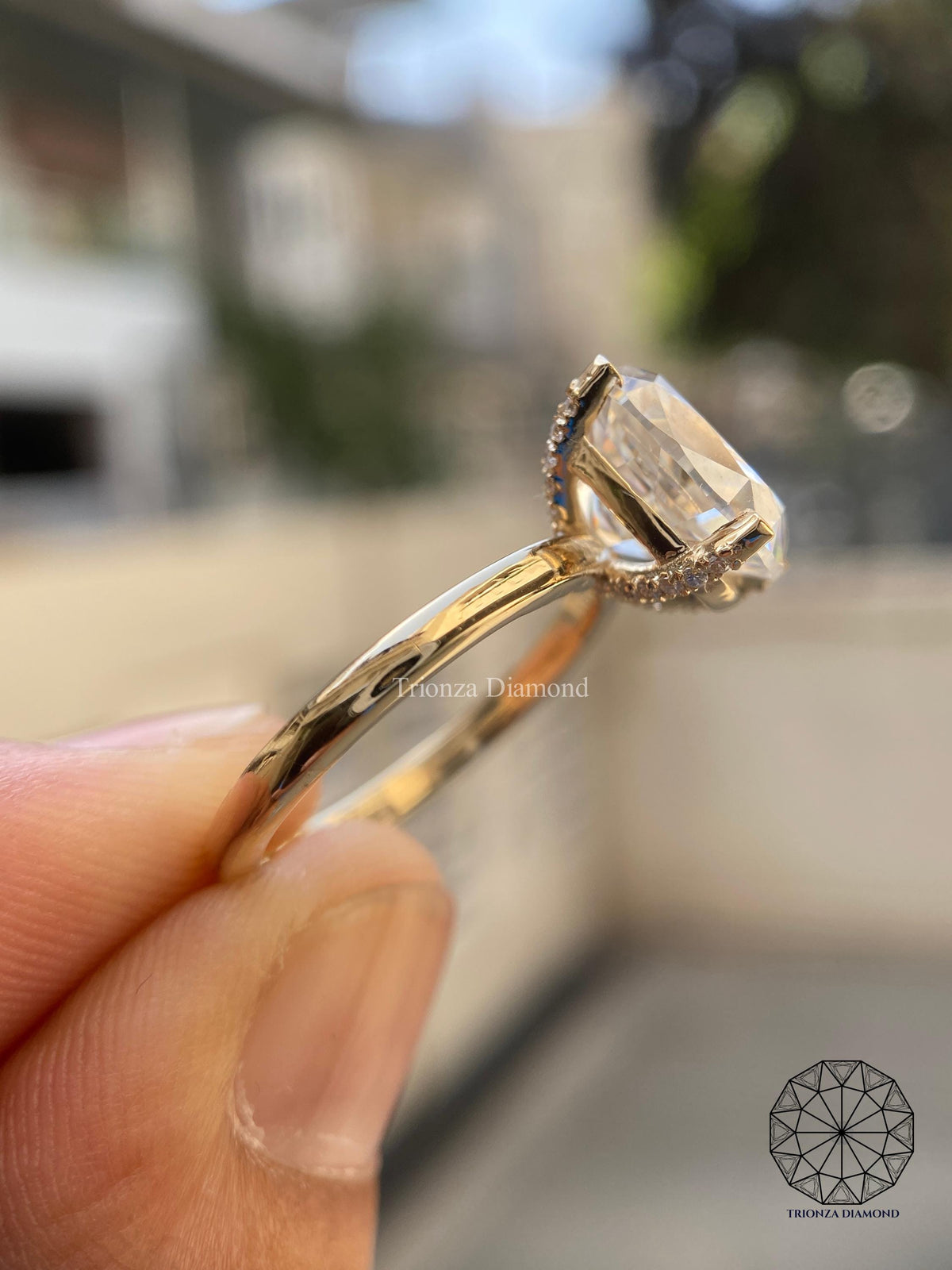 Woman wearing the cushion cut solitaire ring, close-up on her hand