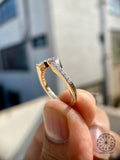 Woman wearing the pave diamond stacking ring alongside a low setting engagement ring