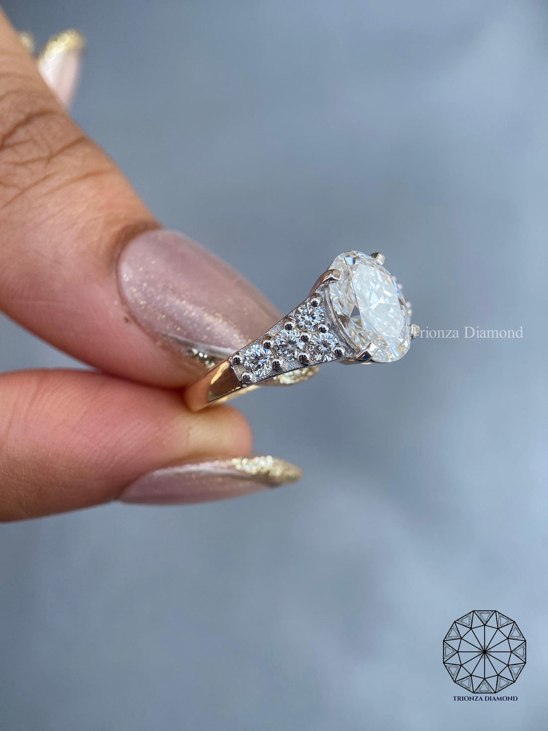 Oval lab grown diamond cluster ring in 14k white gold with a chunky signet band design