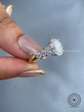 Close-up of the 2.00 CT oval cut diamond set among pave round diamond accents