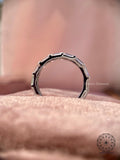 Stackable diamond wedding band shown alongside an engagement ring for a layered look