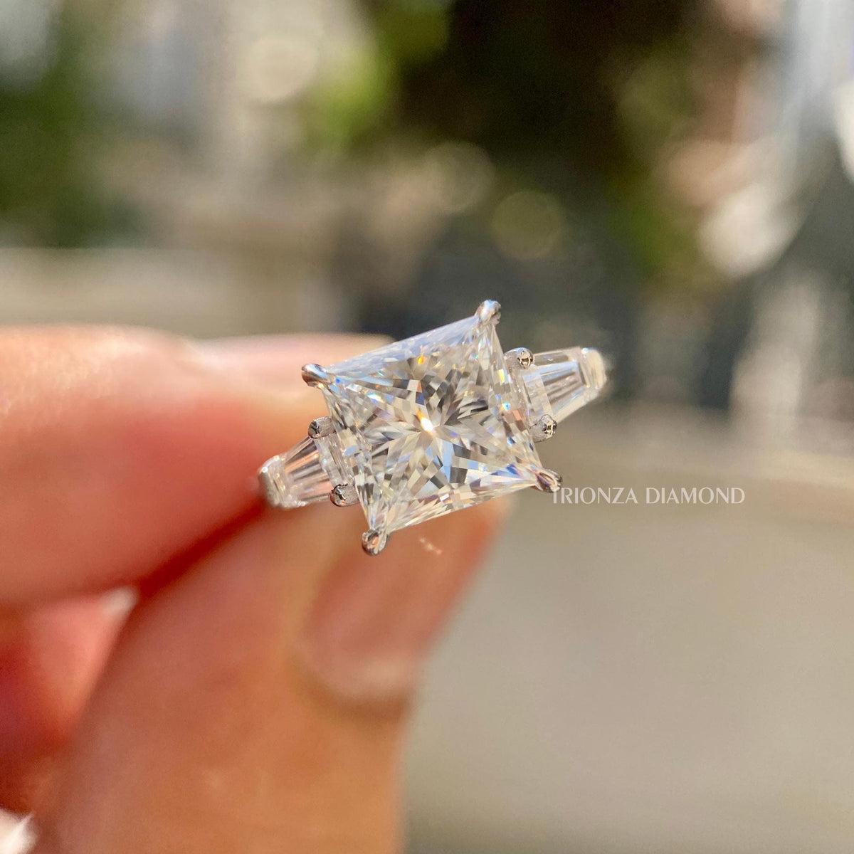 Princess cut lab grown diamond engagement ring with tapered baguette side stones and excellent polish