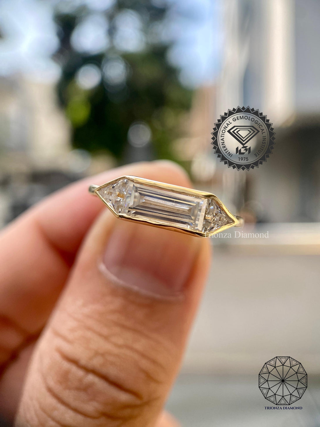 East-west baguette lab grown diamond ring with triangle side stones in 14K yellow gold