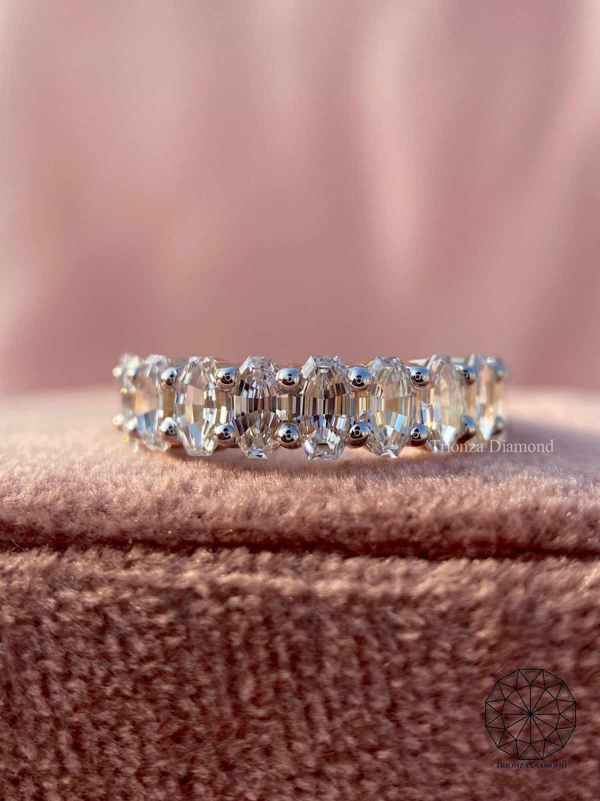 Close-up of the oval cut lab diamonds set in a full eternity band design