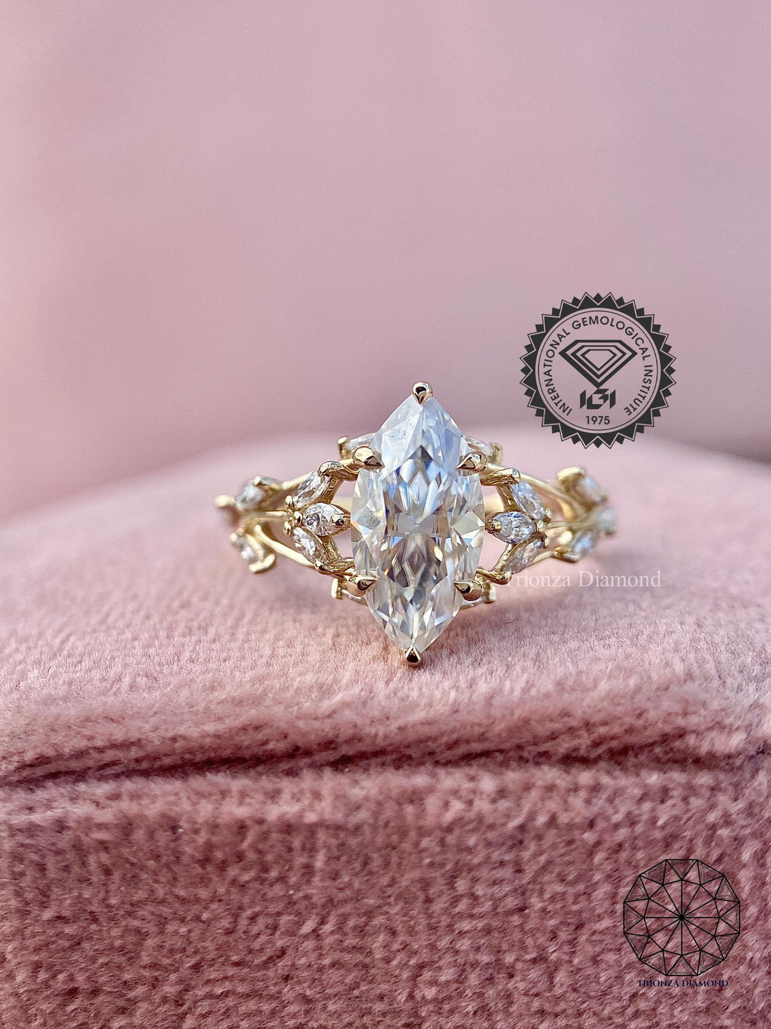 Nature inspired marquise diamond engagement ring displayed in a jewelry box