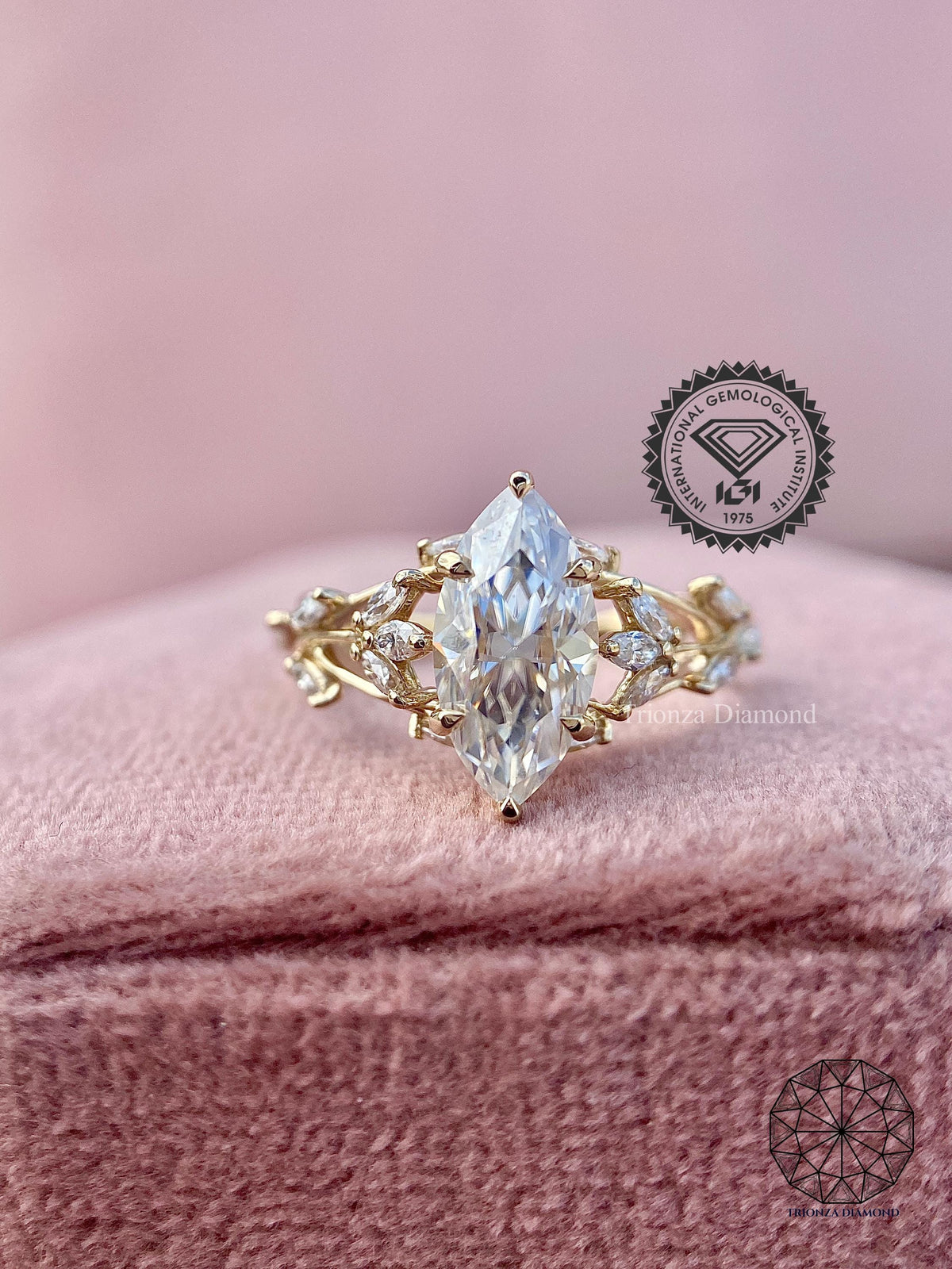 Close-up of the marquise cut lab grown diamond set in a floral branch design