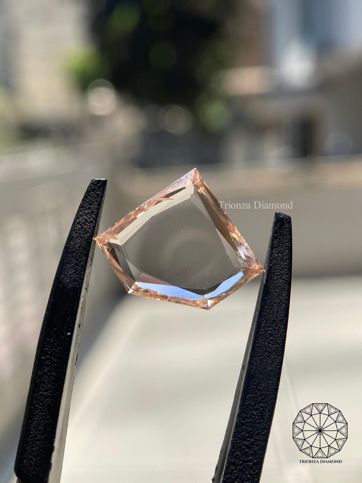Loose trilliant rose cut diamond shown from an angle to display its measurements