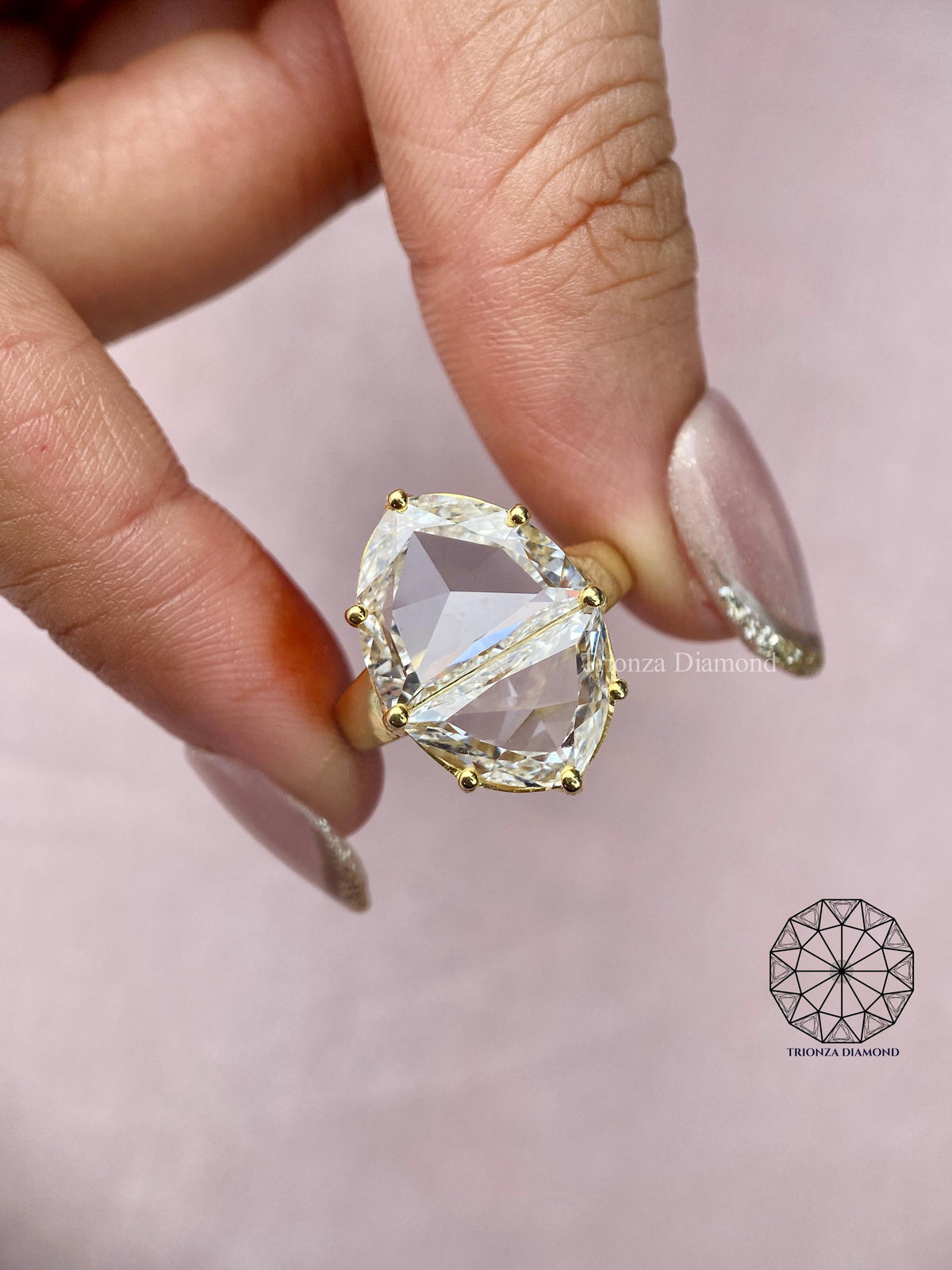 Close-up of the half moon cut lab grown diamonds forming the marquise illusion design