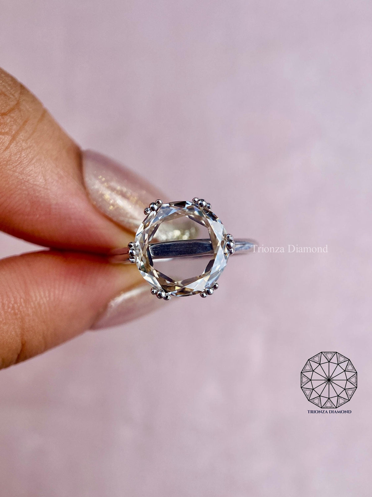 Top view of the round rose cut diamond ring emphasizing its unique statement design