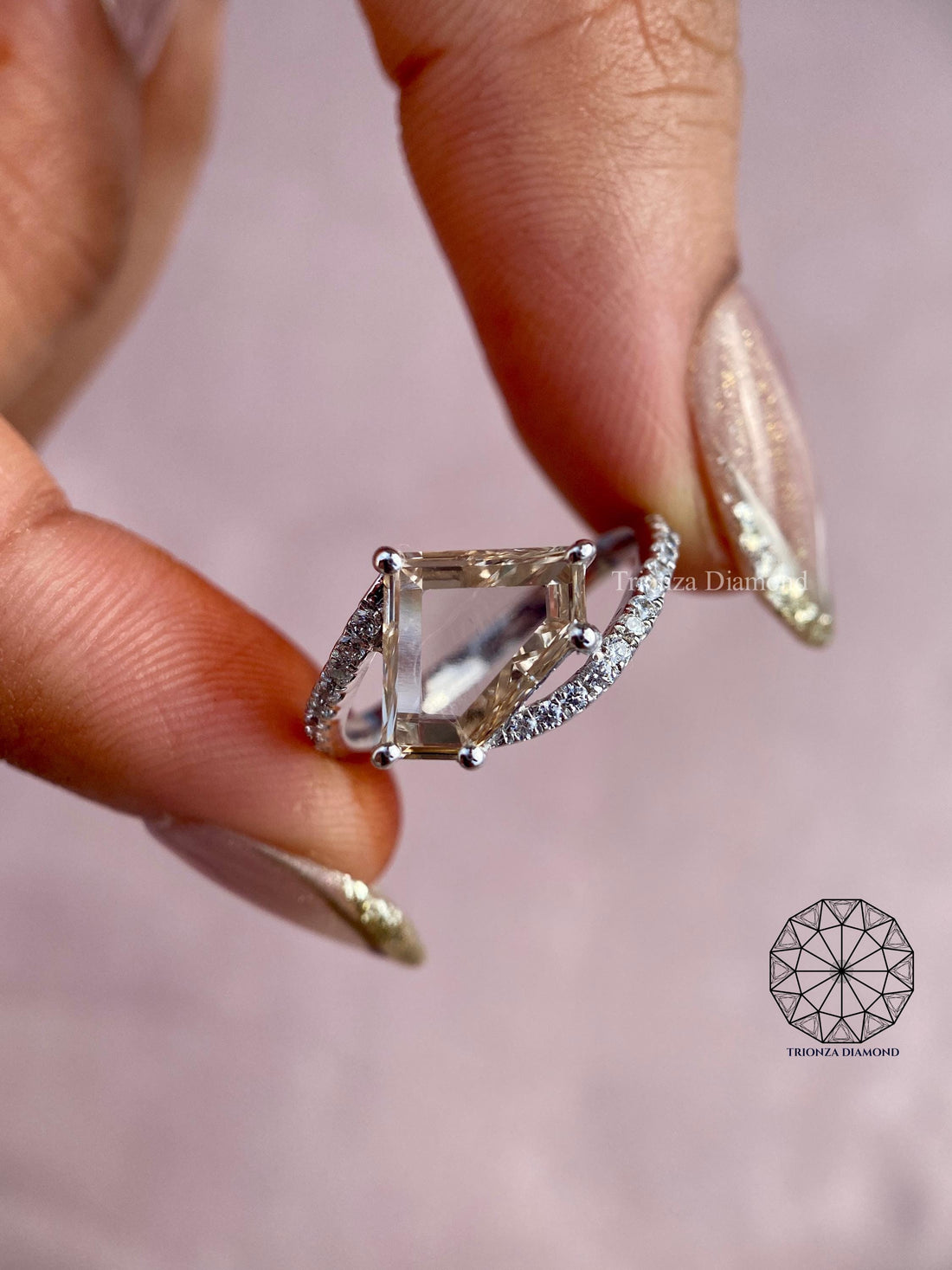 Modified trillion rose cut diamond ring with a bypass shank pave setting displayed up close