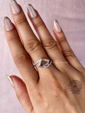 Close-up of the pave set round diamonds along the bypass shank of the ring