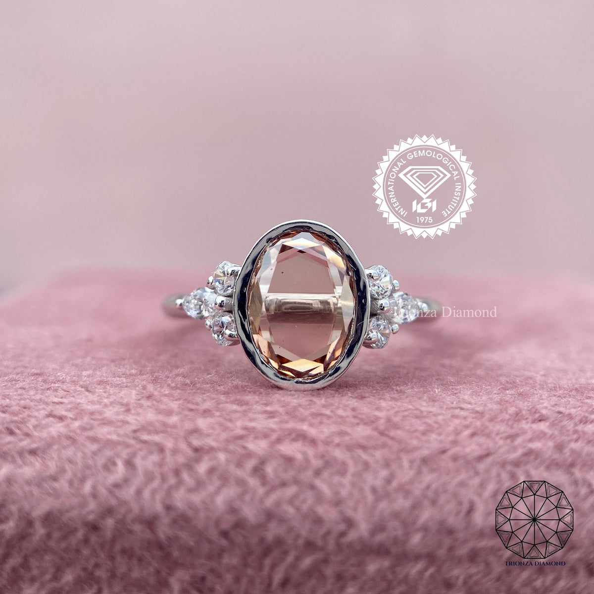 Oval rose cut lab grown diamond ring featuring a bezel setting with round and marquise side stones