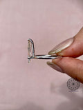 Side profile of the pear shaped diamond ring highlighting the open claw setting details