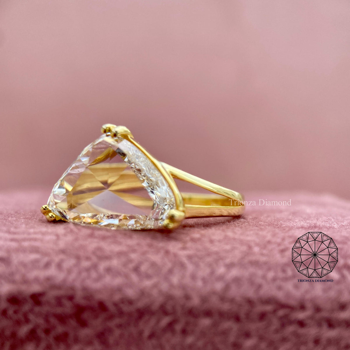 Close-up of the 3.41 CT trilliant rose cut diamond showing its geometric facets