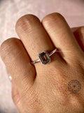 Emerald cut brown diamond ring presented in a jewelry box for gifting
