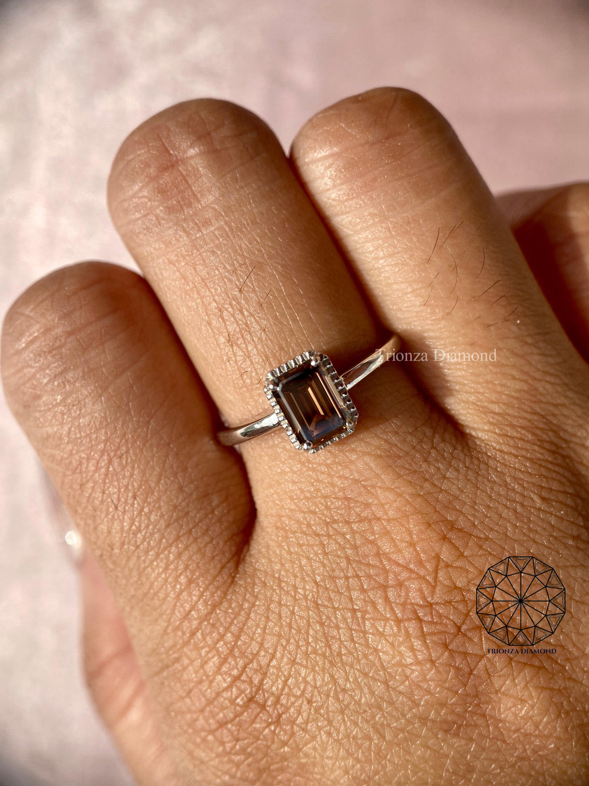 Emerald cut brown diamond ring presented in a jewelry box for gifting