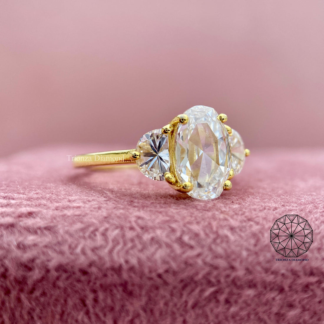 Oval rose cut lab grown diamond ring with half moon side stones in a three stone design