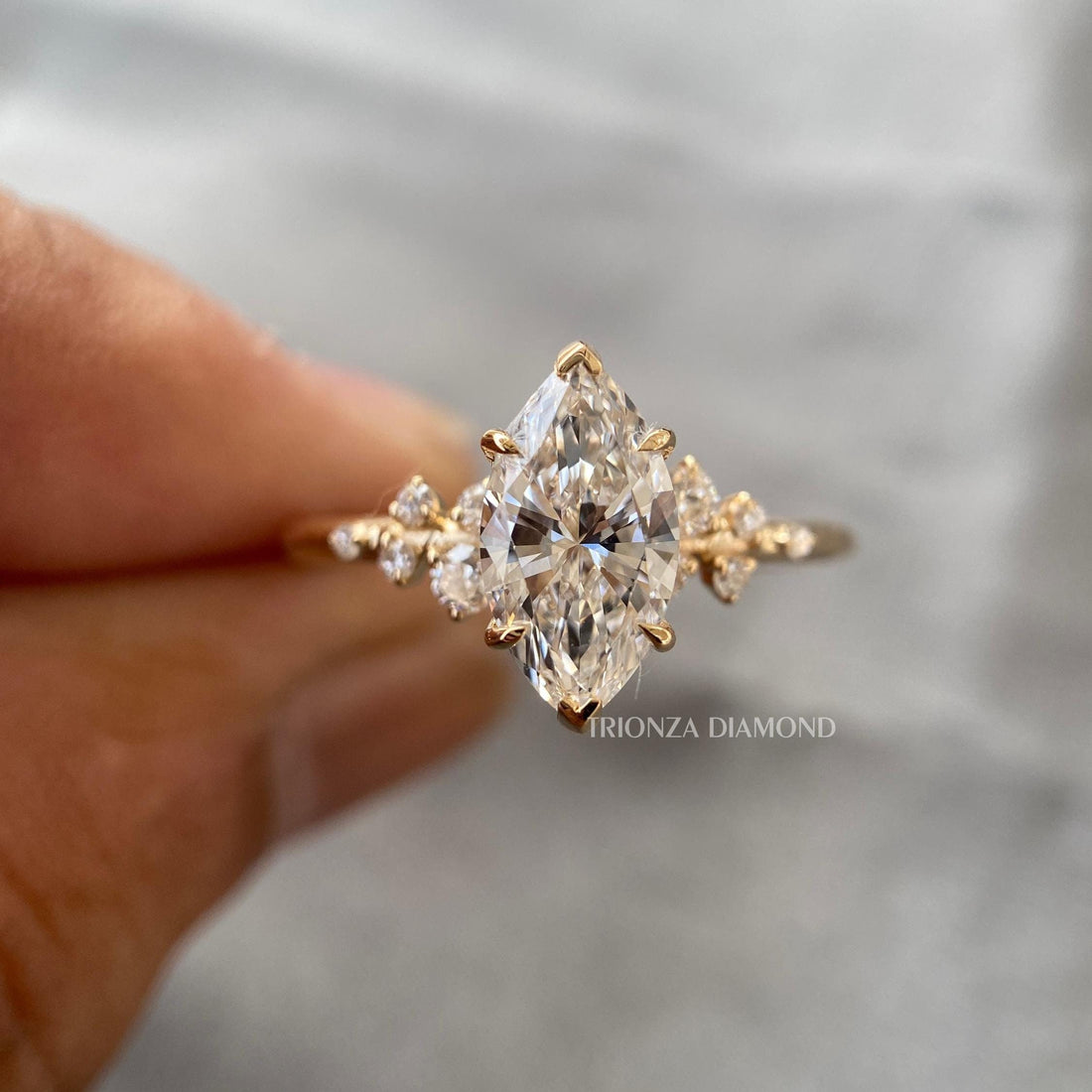 Marquise cut lab grown diamond ring featuring a vine style setting with vintage inspired details