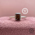 Champagne brown emerald cut diamond ring displayed to show its bezel setting details