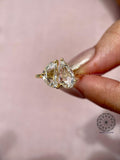 Handcrafted bridal ring displaying the pear and half moon rose cut diamond combination
