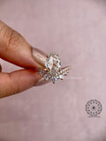 Teardrop diamond engagement ring showing the radiant crown of accent stones around the center stone