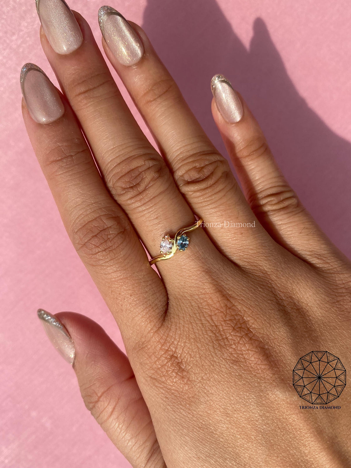 Close-up of the marquise and oval lab grown diamonds set side by side in the toi et moi design