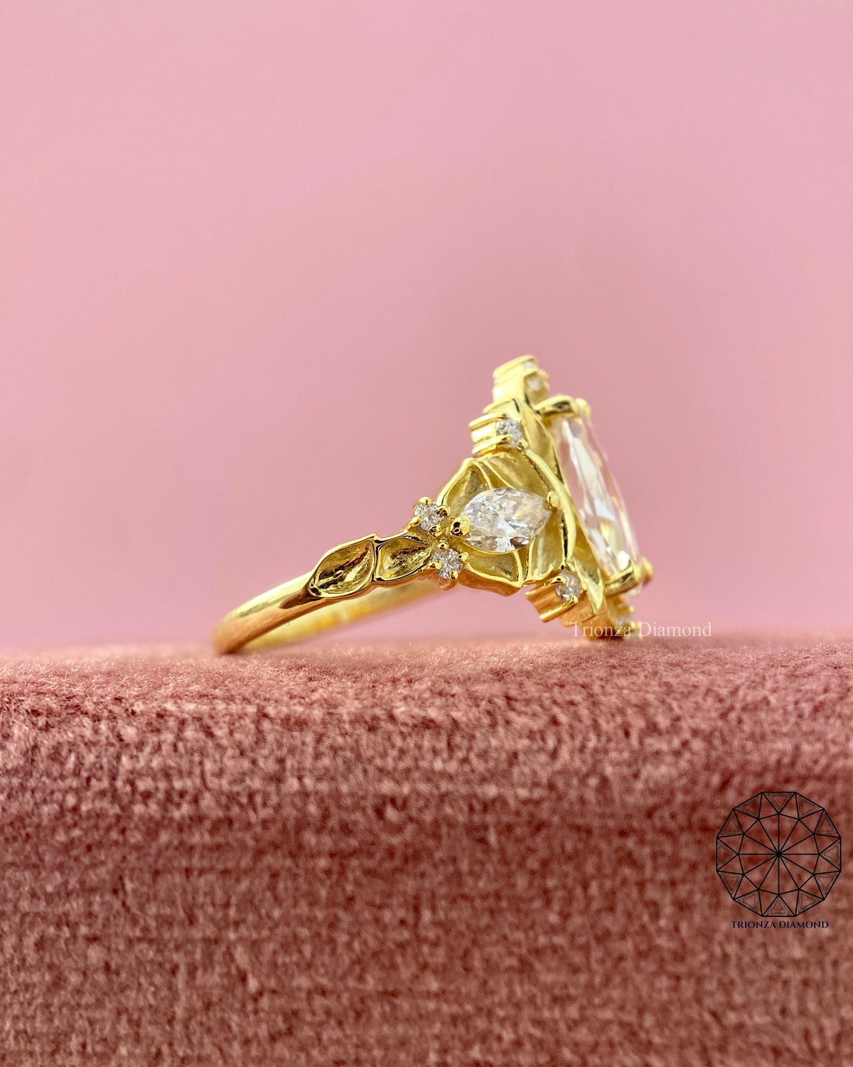 TrionzaDiamond engagement ring crafted with nature inspired leaf motifs for a unique proposal
