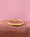 TrionzaDiamond proposal ring crafted with a unique wavy band and pear shaped diamond