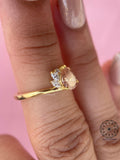 TrionzaDiamond bypass ring featuring a 0.54 carat pear cut pink diamond design