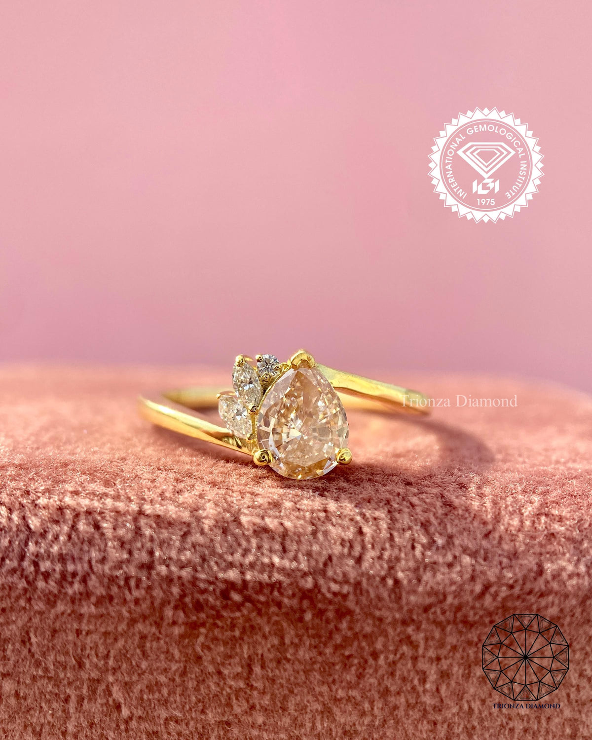 Close-up of the IGI certified pear shaped pink lab grown diamond in its setting