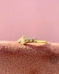 Woman wearing the pink diamond bypass ring, close-up view on her hand