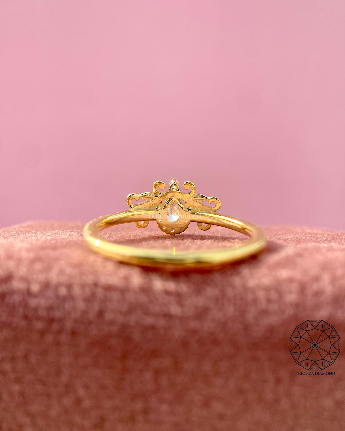 Woman wearing the pear shaped diamond ring, close-up view on her hand