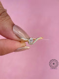 Dainty pear cut diamond ring styled as an anniversary or holiday gift