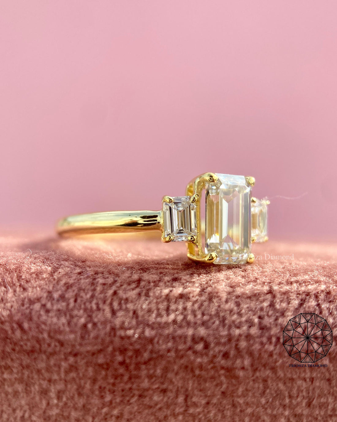 Three stone emerald cut engagement ring in 14k solid gold with a lab grown diamond center stone