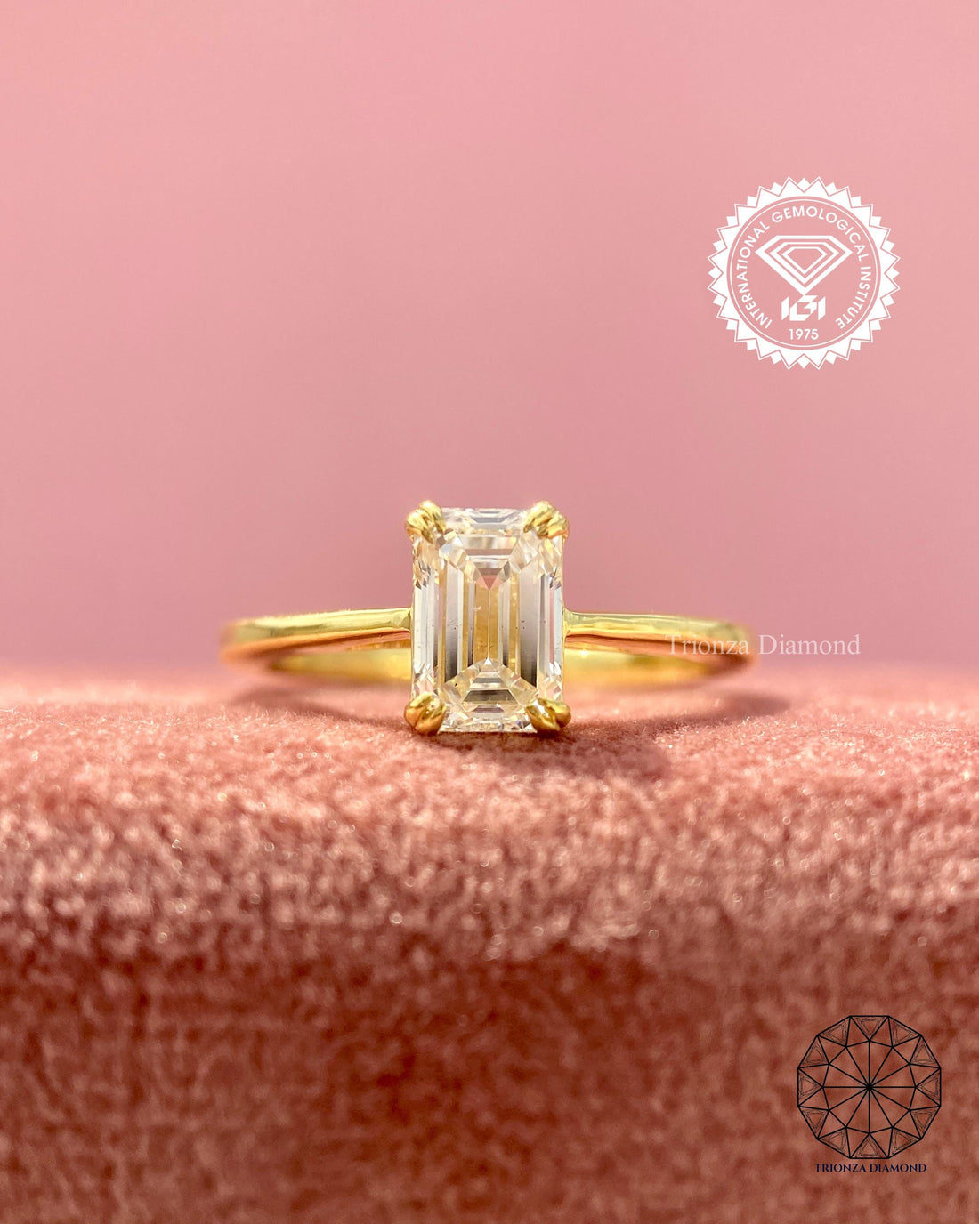 Emerald cut lab grown diamond engagement ring featuring a double claw prong solitaire setting