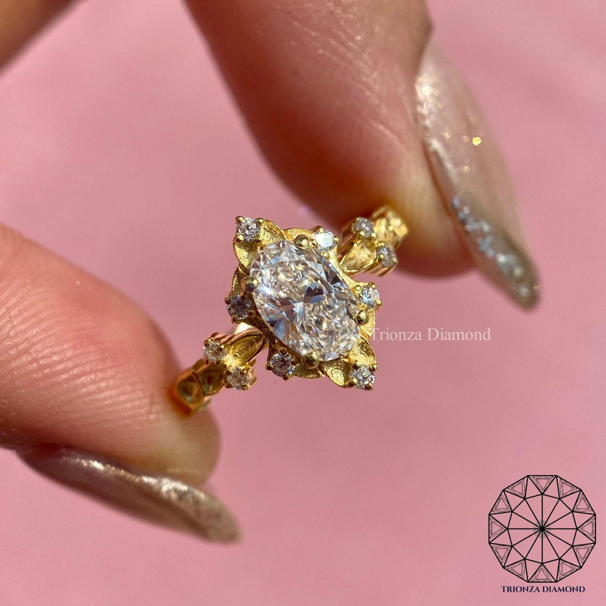 Vintage oval diamond engagement ring with intricate handmade leaf and vine details