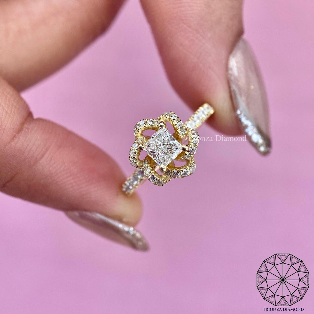 Princess cut lab grown diamond floral halo ring displayed in 14k yellow gold setting