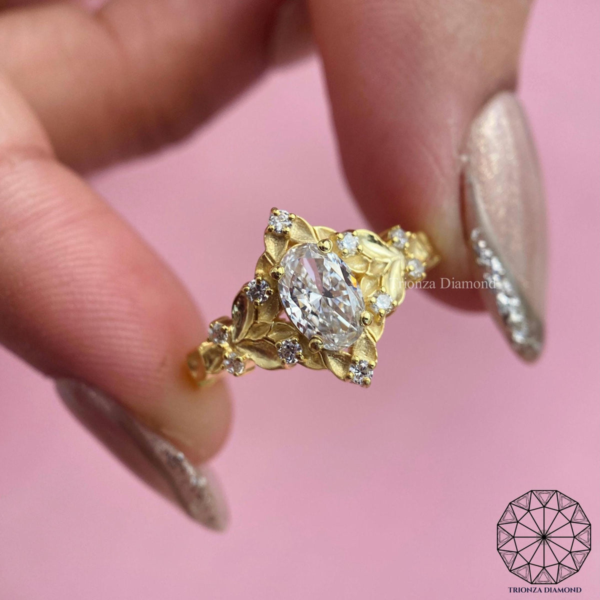 Hidden leaf detail ring showcasing the delicate oval lab grown diamond setting