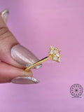 Pink lab diamond wedding ring displayed on a stand to show its overall silhouette