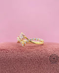 Close-up of the crown style prong setting holding the round pink diamond securely