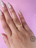 Top view of the round pink diamond engagement ring displayed in its box