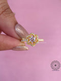 Side view of the nature inspired flower ring highlighting the pave gold band